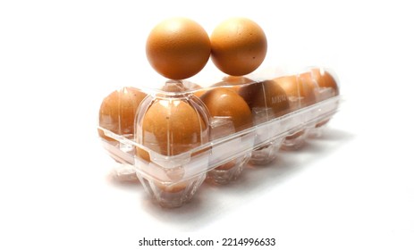 Chicken Eggs In Plastic Egg Tray On A White Background.