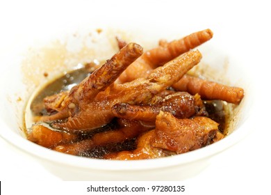 Chicken feet typical Chinese specialty, on white background