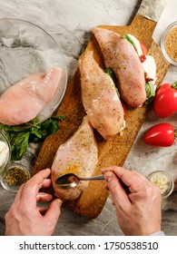 Chicken Fillet Cooking Homemade Stuffed With Cheese And Vegetables On Homemade Kitchen Background By Chef Hands.