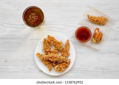 Chicken Fingers With Sauce And Cold Beer, Overhead View. From Above, Top View. Closeup.