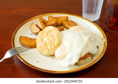 Chicken Fried Steak With Gravy, Fried Eggs And Biscuits