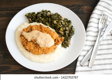 Chicken Fried Steak And Gravy With Mashed Potatoes And Collard Greens