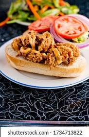 Chicken Fried Steak Sandwich Served With Fried Sun-dried And Jalapeños & Rémoulade Sauce. Classic Brunch Or Breakfast Favorite Paired With Country Biscuits, Fried Eggs And A Champagne Mimosa.