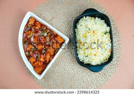 Chicken gravy serve with Chinese Fried rice. Shashlik chicken with rice. egg fries rice
