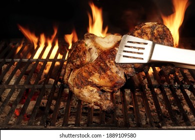 Chicken Grilled On Hot Barbecue Charcoal Flaming Grill. Juicy Whole Chicken Meat Roasted On BBQ Grill. Backyard Grill Party Dish From Poultry Isolated On Black Background, Closeup View.