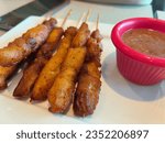 Chicken grills stacked in wooden sticks.Also known in Malaysia as Satay.