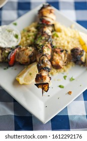 Chicken Kabobs. Cubes Of Grilled Chicken, Grilled Vegetables, Onions Bell Peppers And Seasoned With Garlic And Spices. Served With Rice, Traditional Classic Greek Or Italian Restaurant Favorite. 