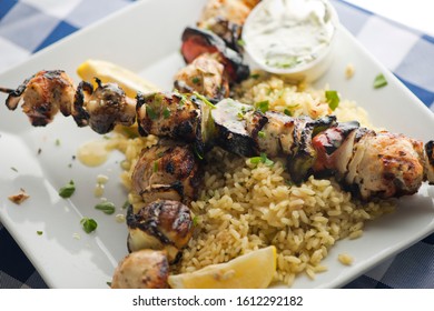 Chicken Kabobs. Cubes Of Grilled Chicken, Grilled Vegetables, Onions Bell Peppers And Seasoned With Garlic And Spices. Served With Rice, Traditional Classic Greek Or Italian Restaurant Favorite. 