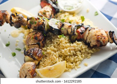 Chicken Kabobs. Cubes Of Grilled Chicken, Grilled Vegetables, Onions Bell Peppers And Seasoned With Garlic And Spices. Served With Rice, Traditional Classic Greek Or Italian Restaurant Favorite. 