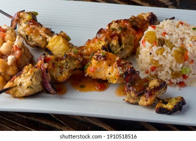 Chicken Kabobs. Cubes Of Grilled Chicken, Grilled Vegetables, Onions Bell Peppers And Seasoned With Garlic And Spices. Served With Rice, Traditional Classic Greek Or Italian Restaurant Favorite. 