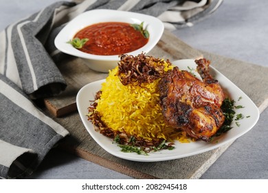 Chicken kabsa - homemade arabian rice with tomato sauce 
