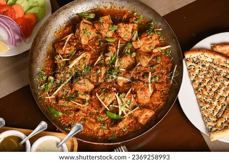 Chicken karahi with roghni naan and salad, desi food in Lahore Pakistan, asian spicy food, boneless chicken karahi