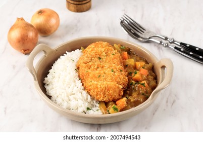 Chicken Katsu With Japanese Curry, Serve With White Rice On Brown Ceramic Plate Above White Marble Table, With Copy Space For Text Or Recipe