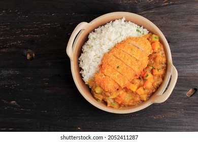 Chicken Katsu Pork Tonkatsu With Japanese Curry, Serve With White Rice On Brown Ceramic Plate Above Wooden Black Table, With Copy Space For Text Or Recipe