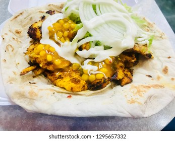 Chicken Kebab In Naan Bread Served With Salad And Sweetcorn Relish 