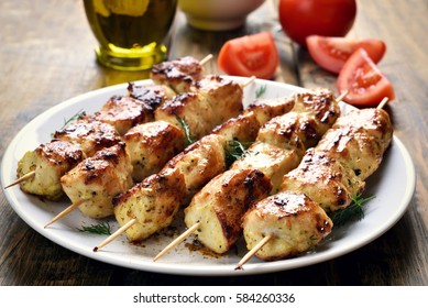 Chicken kebab on plate, close up view
