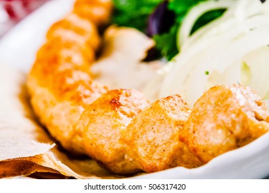 Chicken kebab with onion and herbs - Powered by Shutterstock