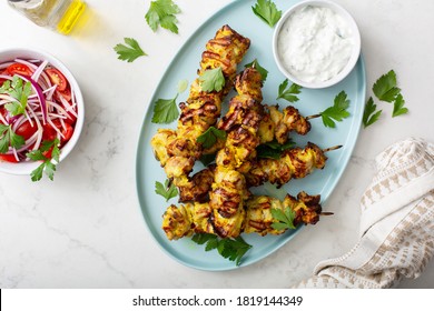 Chicken Kebab Yogurt Marinated With Tzatziki Sauce And Vegetable Salad