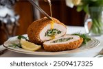 Chicken Kiev:
Juicy chicken breast stuffed with garlic butter, breaded and fried to a crispy, golden finish.