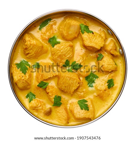 Chicken Korma isolated on white. Indian cuisine meat curry dish with coconut milk masala. Asian food