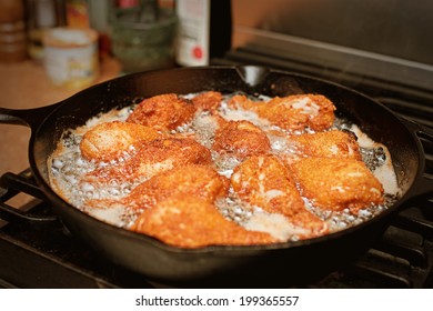 Chicken Legs Frying In A Pan