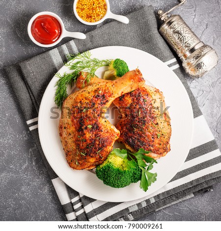 Chicken Legs with Vegetables on gray  background.Top view.