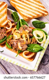 Chicken Liver, Spinach and Onion Sandwiches on White Plate