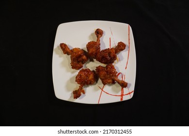 Chicken Lollipop Or Chicken Drumstick On A White Plate In Black Background