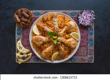 Chicken Mandi With Dates On A Black Table. Arabic Cuisine. Top View.