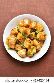 Chicken Meat With Orange Sauce And Green Onion, Top View