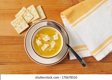 Chicken Noodle Soup With Saltine Crackers Shot From Above
