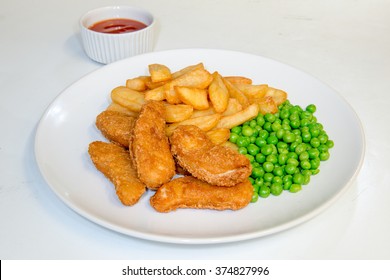 Chicken Nuggets Meal With Chips, Peas And Tomato Dipping Sauce