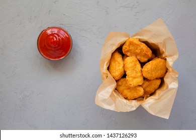 Chicken Nuggets In A Paper Box, Ketchup On A Gray Background. Overhead, From Above, Flat Lay. 