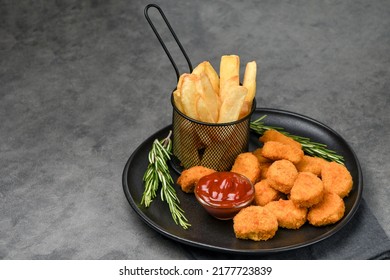 Chicken nuggets with potatoes french fries and ketchup - Shutterstock ID 2177723839