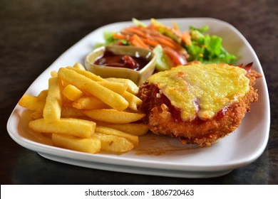 Chicken Parmigiana And Chips Decorate With Salad.