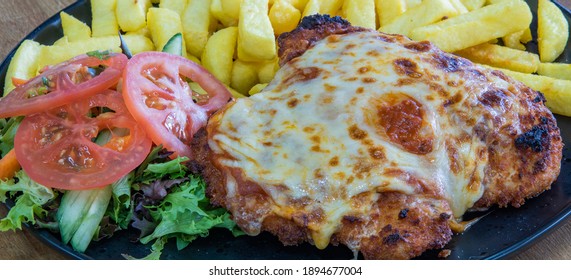 Chicken Parmigiana With Chips And Salad