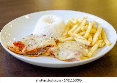 Chicken Parmigiana File With White Rice And Chips