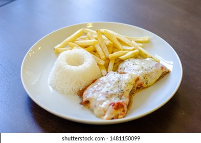 Chicken Parmigiana File With White Rice And Chips