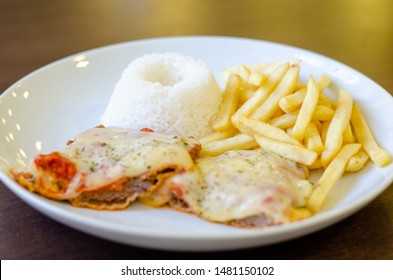 Chicken Parmigiana File With White Rice And Chips