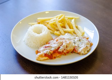 Chicken Parmigiana File With White Rice And Chips