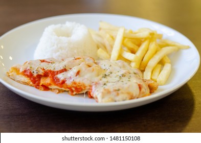 Chicken Parmigiana File With White Rice And Chips