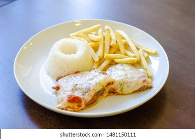 Chicken Parmigiana File With White Rice And Chips