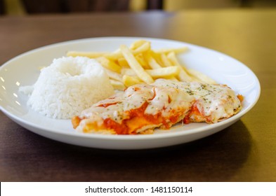 Chicken Parmigiana File With White Rice And Chips