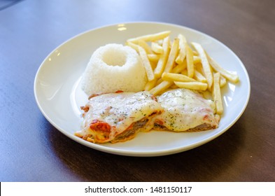 Chicken Parmigiana File With White Rice And Chips