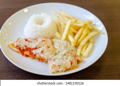 Chicken Parmigiana File With White Rice And Chips