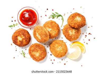 Chicken patties or fish cakes fried in breadcrumbs with ketchup and lemon slices. isolated on white background, top view - Shutterstock ID 2115023648