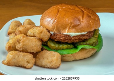 Chicken Patty On Pickles Served With  Veggie Tots, 