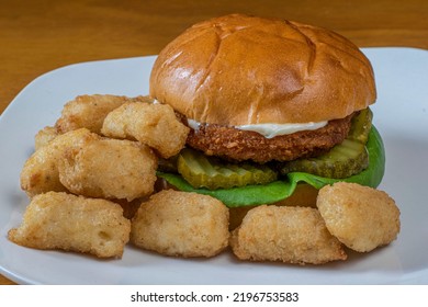 Chicken Patty On Pickles Served With  Veggie Tots