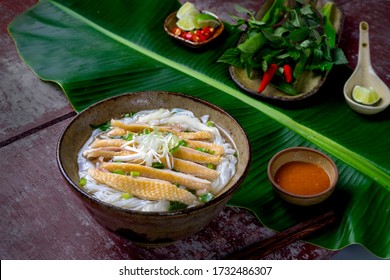 Chicken Pho Or Pho Ga On A Table Kitchen In Hanoi, Vietnam. Including Chicken, Fresh Rice Noodle, Herb On Broth. Everyday Food In Vietnam And Famous In The World