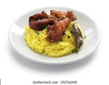 chicken and pork adobo over yellow rice, filipino food isolated on white background